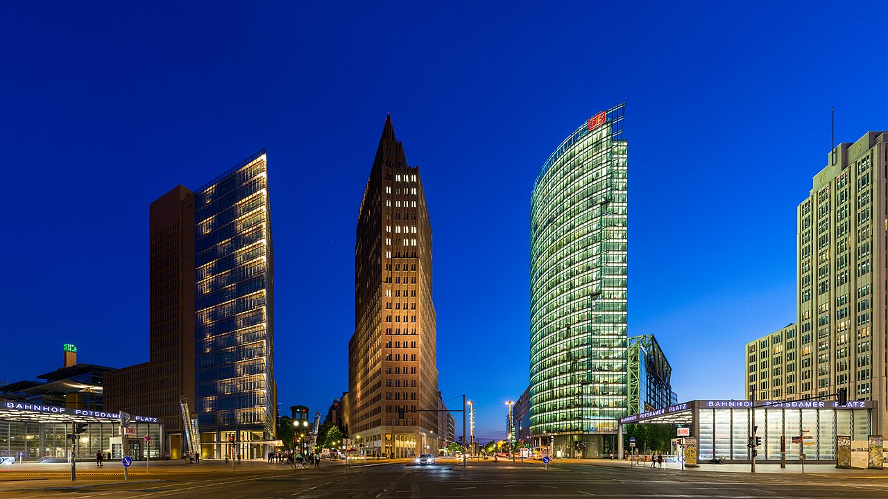 Skyscapers at Potsdamer Platz, Berlin at the end of the blue hour. Buildings and their architects from left to right: Atrium-Tower (Renzo Piano), Kollhoff-Tower (Hans Kollhoff), Ba