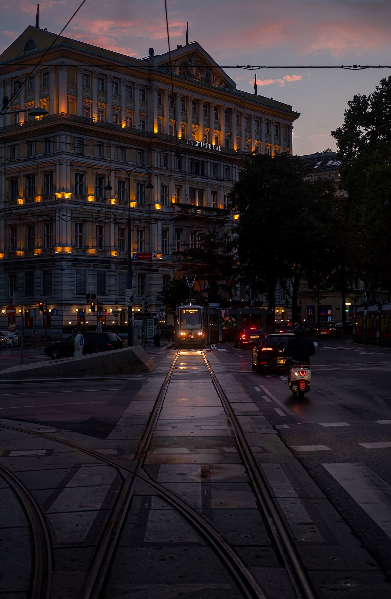 Tram in Kärntner Ring, near Hotel Imperial, at twilight, photograph taken from the back window of another tram (Vienna, Austria)