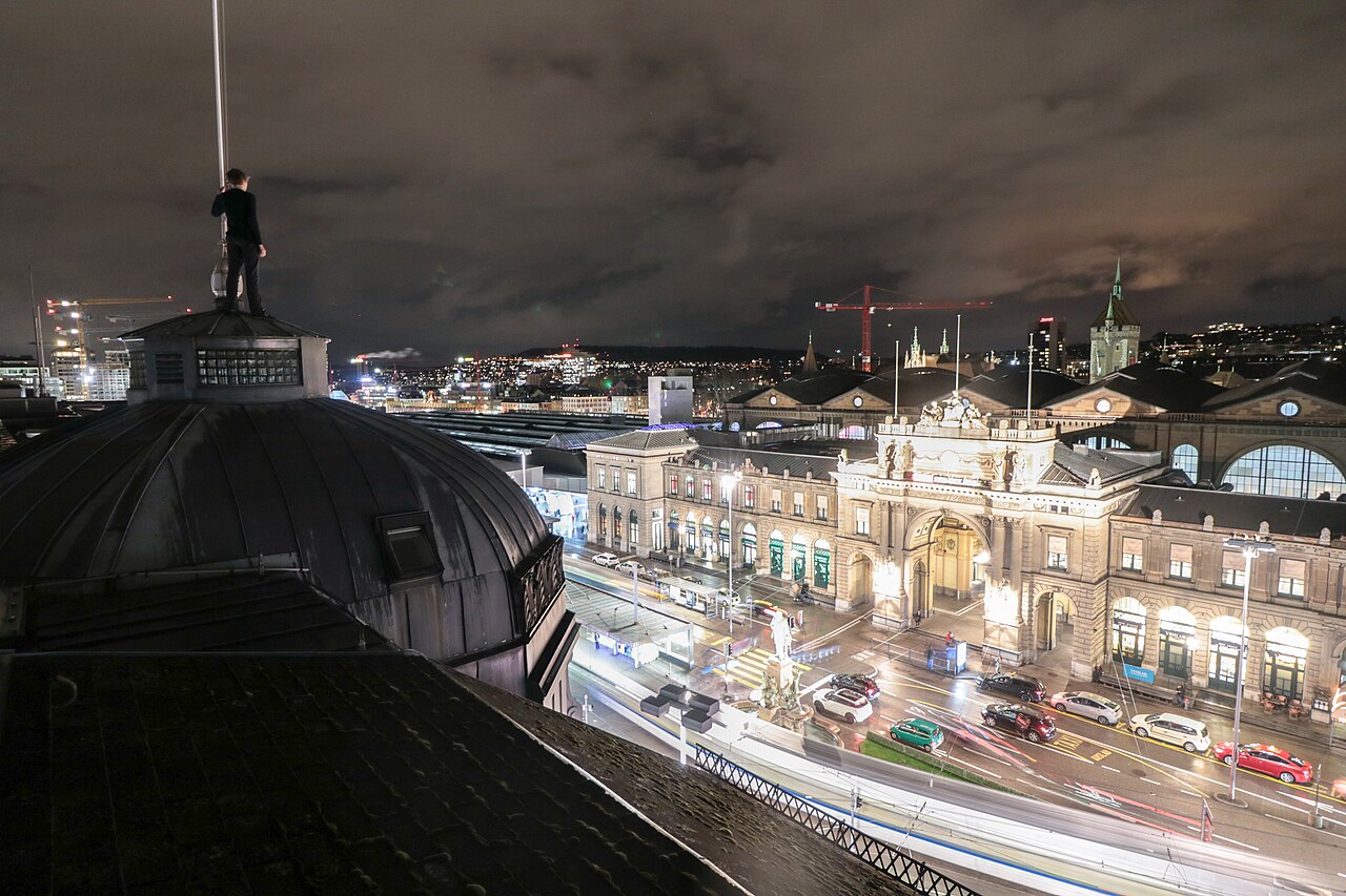 The picture shows a rooftopper on a building near the main train station in Zurich, Switzerland.
